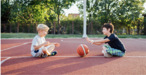 Kids playing basketball in the backyard