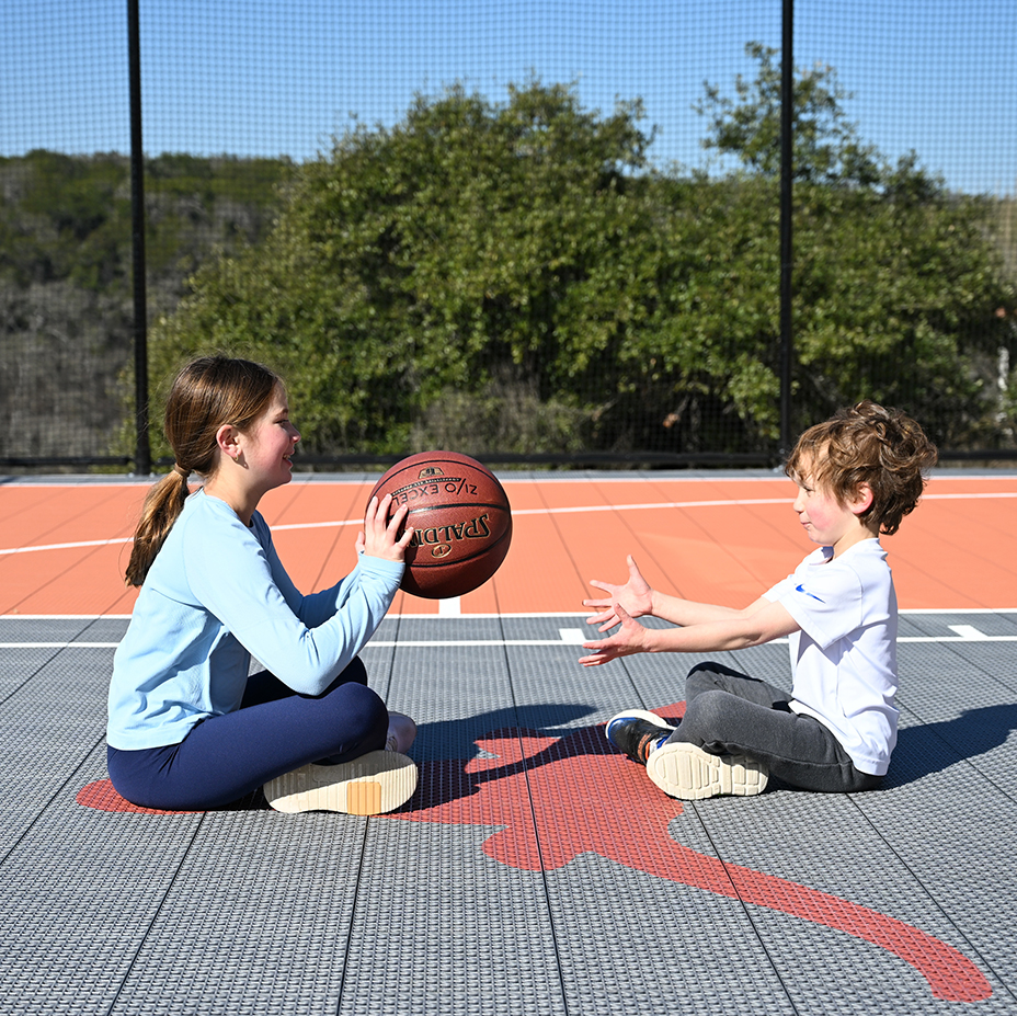 Residential Game Courts Two kids on game court by Casa Courts